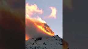 Snowy mountain looks like it's on fire!