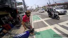 Kind motorcycle rider helps elderly woman cross busy road