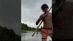 Scary alligator creeps up behind Florida man showing off his catch
