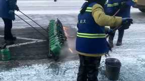 Sanitation workers ignite flames to tackle icy streets