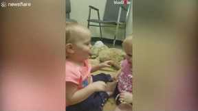 Mom catches her twin baby girls hugging each other