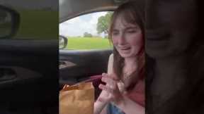 Woman freaks out when hungry ostrich sticks head through car window