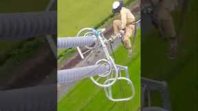 Brave electrician dangles 100 metres in the air as he repairs power lines