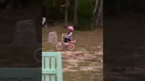 Older brother hypes up little sister for riding her bike