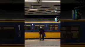 Elderly couple hug it out at Amsterdam airport subway
