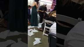 Bride's cousin slips during wedding aisle walk