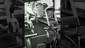 Man attempts to take sweater off on treadmill