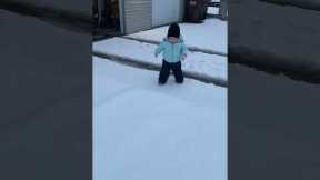 Toddler hilariously faceplants in the snow