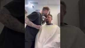 Barber gives his customers surprise kiss