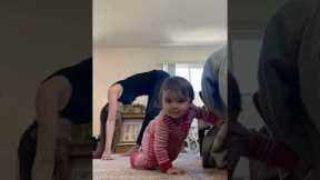 Baby girl joins mom in morning stretches
