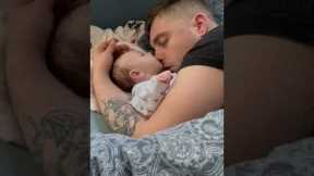 Sleeping baby girl tries to eat dads nose
