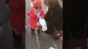 Toddler snatches food out of birds mouth