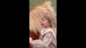 Adorable scene as young sisters show their love for tiny pony