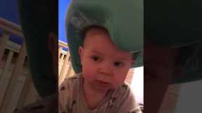 Hilarious toddler wears toilet seat on head like cowboy hat