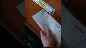 Feisty cat refuses to let postman put mail through