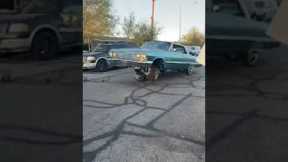 Low rider driver accidentally lands on tire