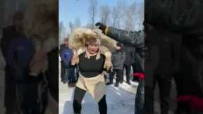 Woman wins unusual sheep squatting competition (50kg sheep, 60 squats)