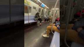 Commuters play soccer with dropped orange on subway