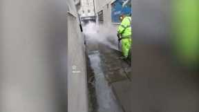 Window cleaner pressure washes his hometown's filthy pavements, what a hero!