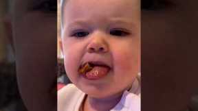 Toddler's hilarious attempt to eat chicken chunks