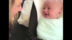 Newborn baby boy tries to talk to his mom