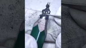 Miniature sculptor's UNREAL pencil carving of 'Anubis'