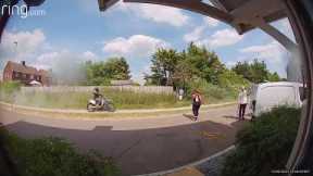 Shocking moment biker speeding along sidewalk almost hits young boys