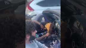 Guy replaces car steering wheel with Timberland boot
