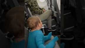 10-month-old delights passengers on delayed flight