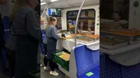 Caterer finishes food prep in the middle of a train in Germany