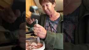 Funny grandma attempts to cut frozen meatballs