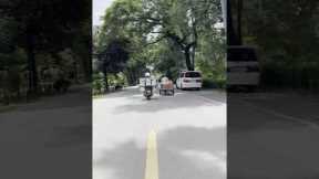Motorcycle rider carries 12 buckets on the back of his bike