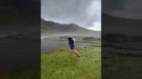 Wow! Windy weather produces gusts so strong that man can fully lean forward without falling