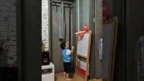 Toddler accidentally makes awesome trick shot