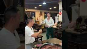 Restaurant owner shows off robotic serving skills