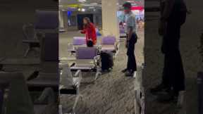 Airport staff wake up sleeping passenger