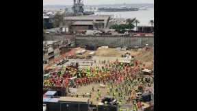 Huge gathering of construction workers stretch