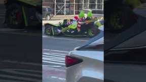 Grinch drives through NYC in flash sports car