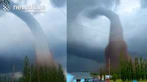 Extraordinary Landspout Tornado Footage Captured In Alberta  || Newsflare
