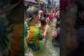Filipinos Party Through Flooded Street