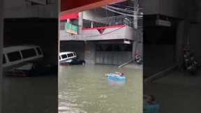 Man Enjoys Flooded City Streets In Quezon City