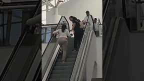 Clueless Women Climb Up The Down Escalator