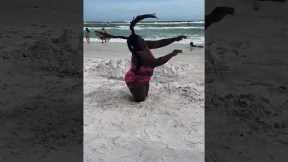 Woman Does Unique Beach Dance