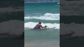 Lady takes pet duck for swim in Gold Coast surf