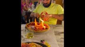 Chef Serves Flaming Pizzas