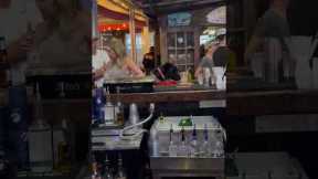 Dog Drinks At A Bar