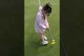 Young Girl Cheats At Golf