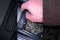Car Cubby Occupied by Sleepy Kitten