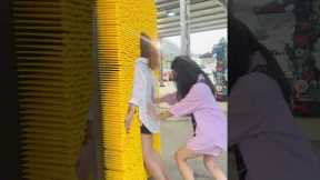 Tourists Play With Giant Pin Toy